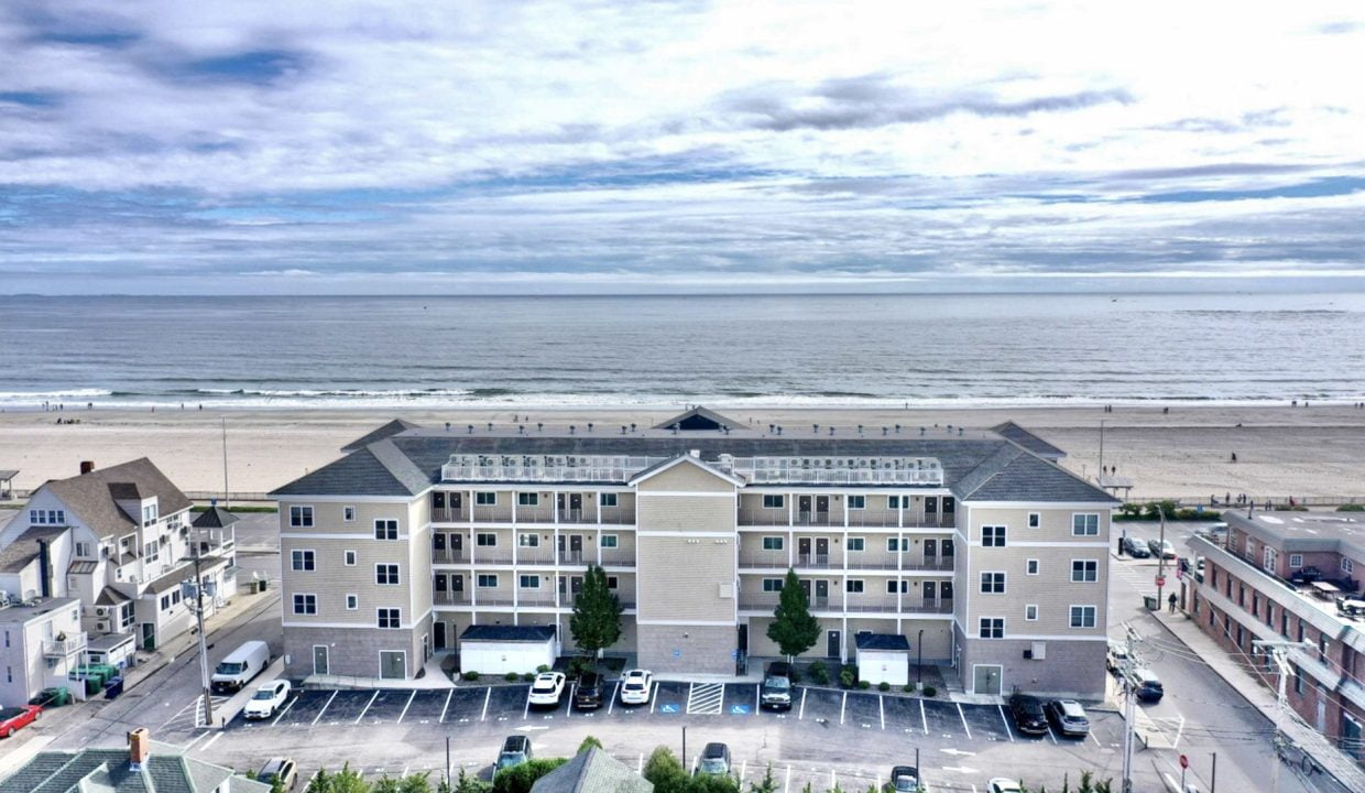 an aerial view of a beach front hotel.