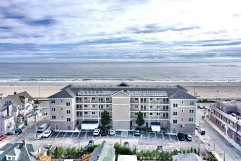 an aerial view of a beach front hotel.