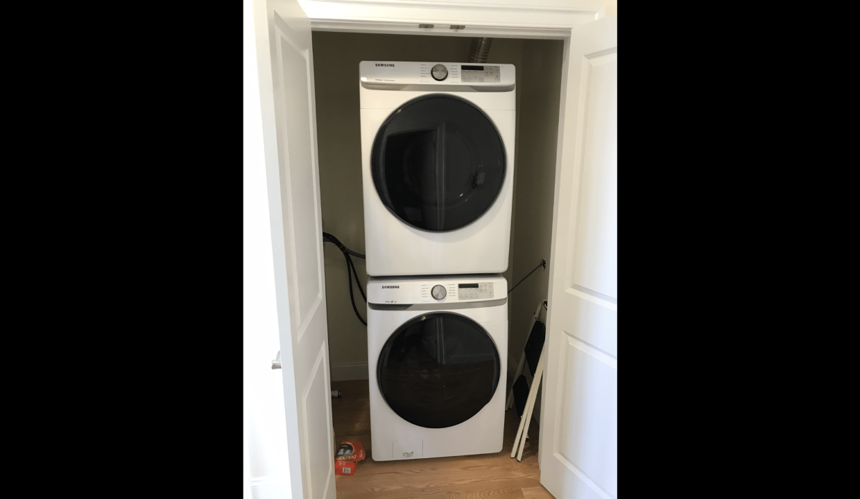 a white washer and dryer in a room.