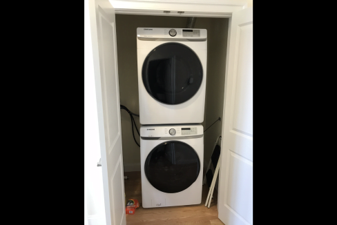 a white washer and dryer in a room.