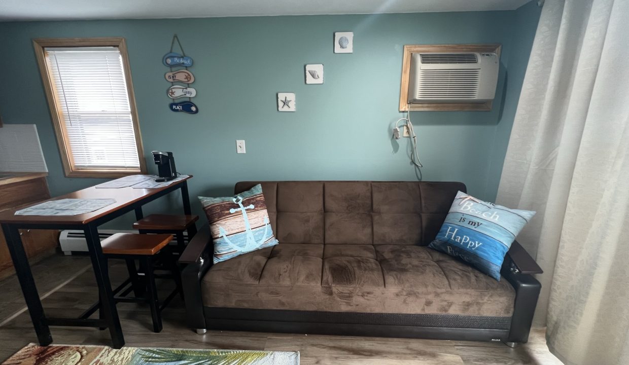 a living room with a couch and a table.