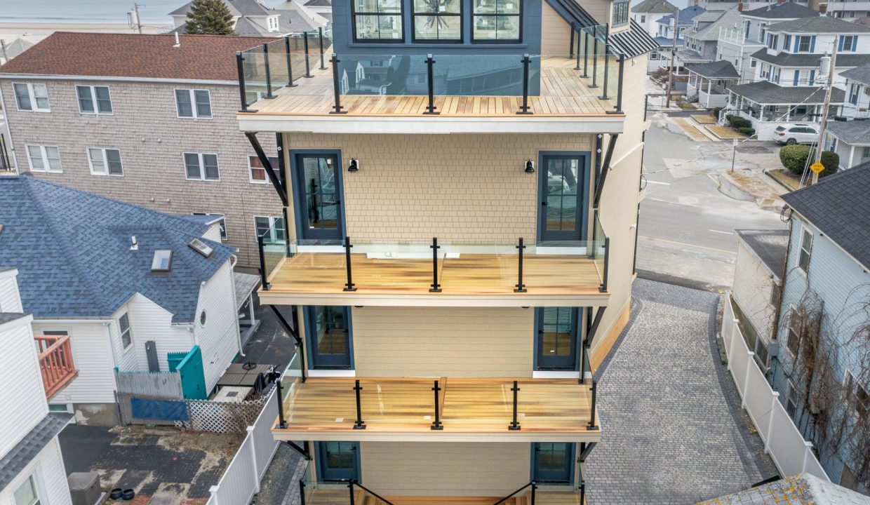 an aerial view of a three story house.