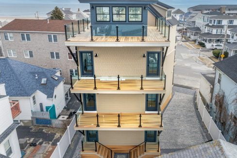 an aerial view of a three story house.