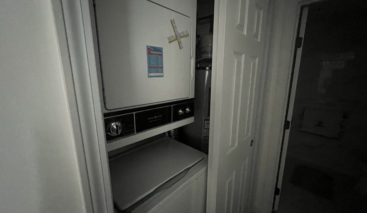 a washer and dryer in a small room.
