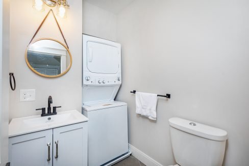 a bathroom with a washer and dryer in it.