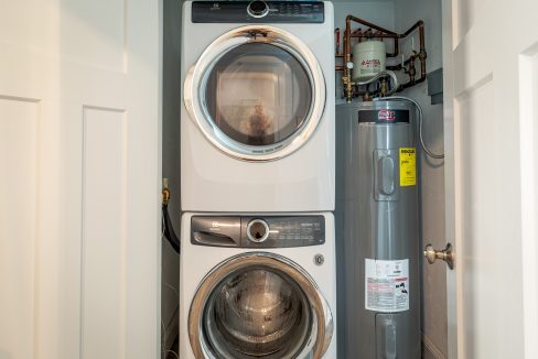 a washer and dryer in a small room.