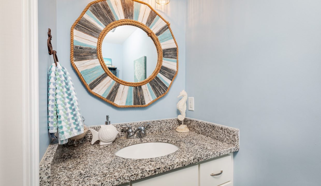 a bathroom with a sink and a mirror.