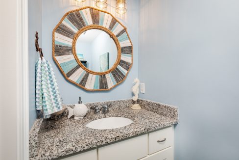 a bathroom with a sink and a mirror.