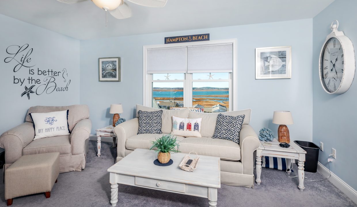 a living room filled with furniture and a clock on the wall.