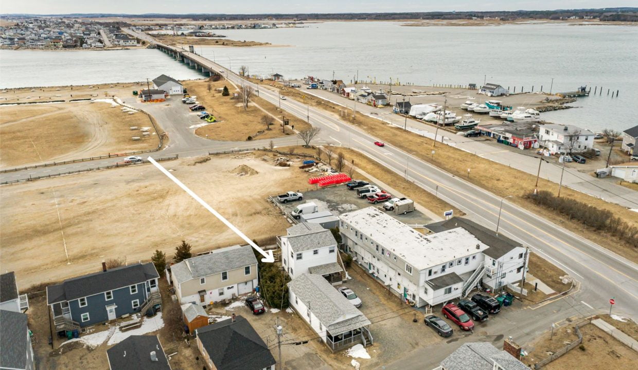 an aerial view of a town by the water.