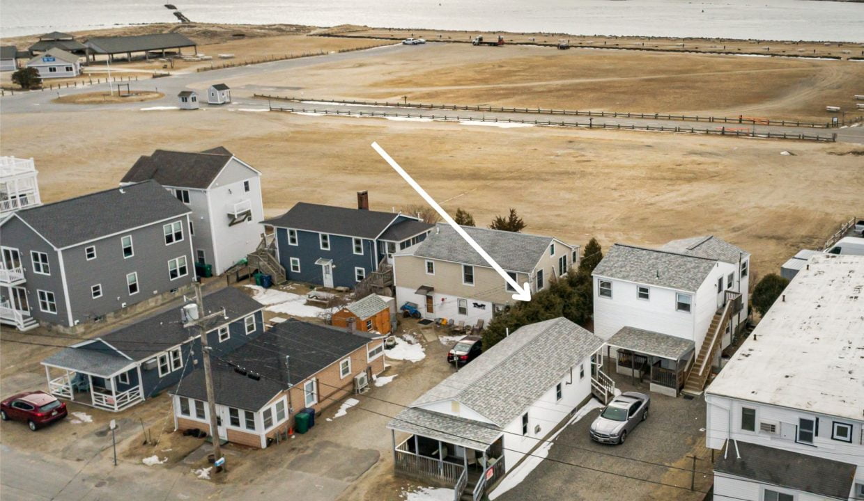 an aerial view of several houses in a neighborhood.