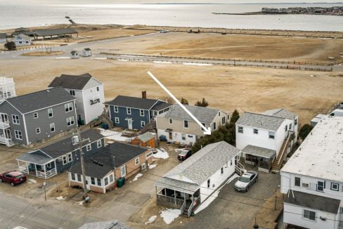 an aerial view of several houses in a neighborhood.