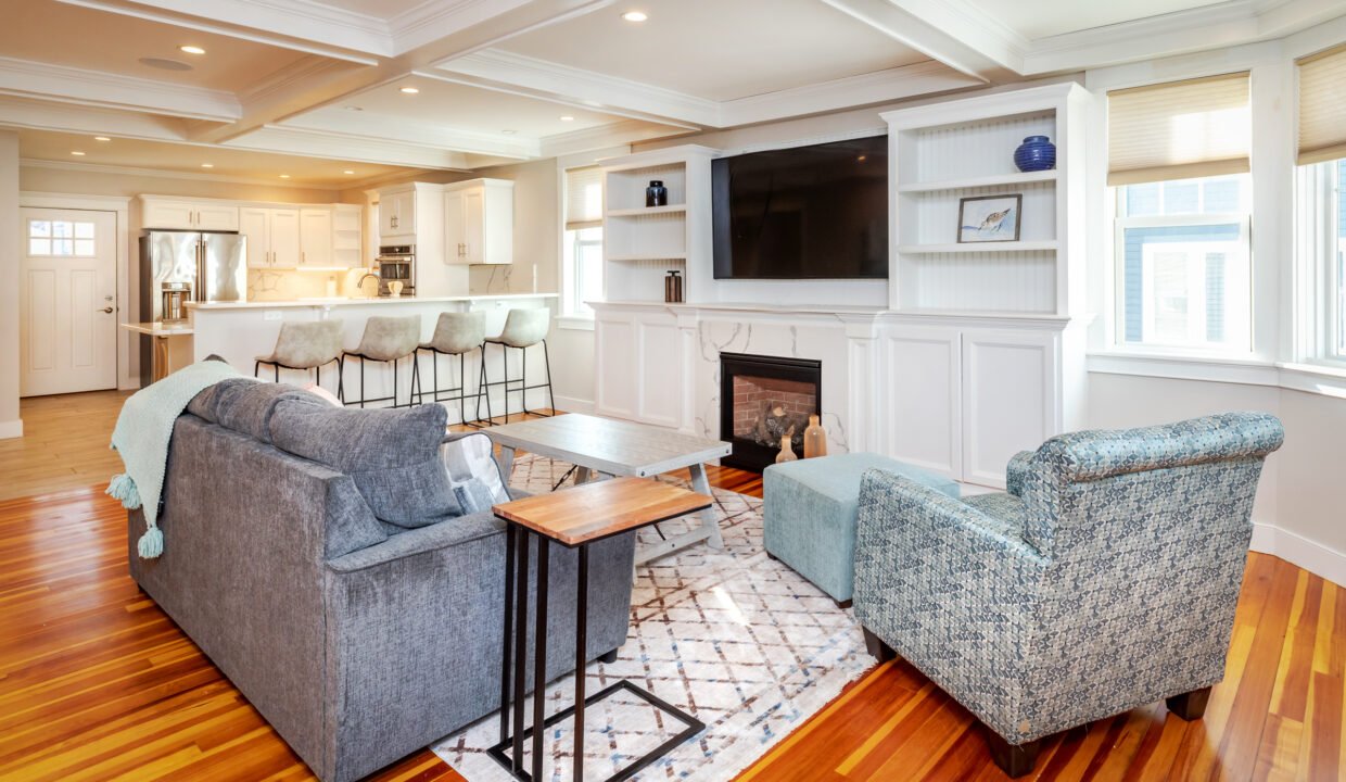 a living room filled with furniture and a fire place.