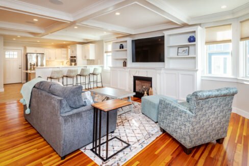 a living room filled with furniture and a fire place.