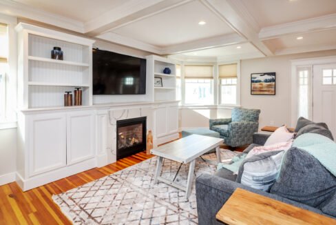 a living room filled with furniture and a fire place.