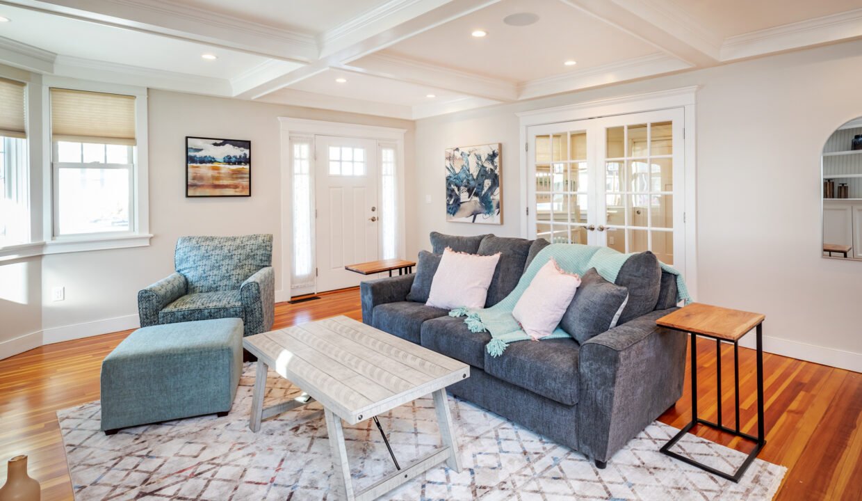 a living room filled with furniture and a table.