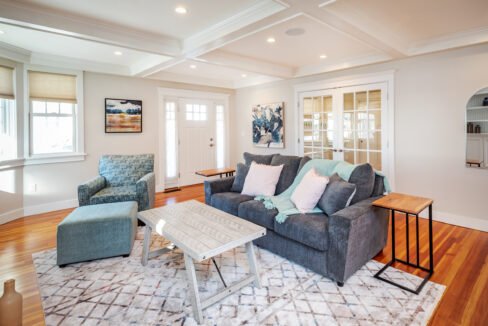 a living room filled with furniture and a table.