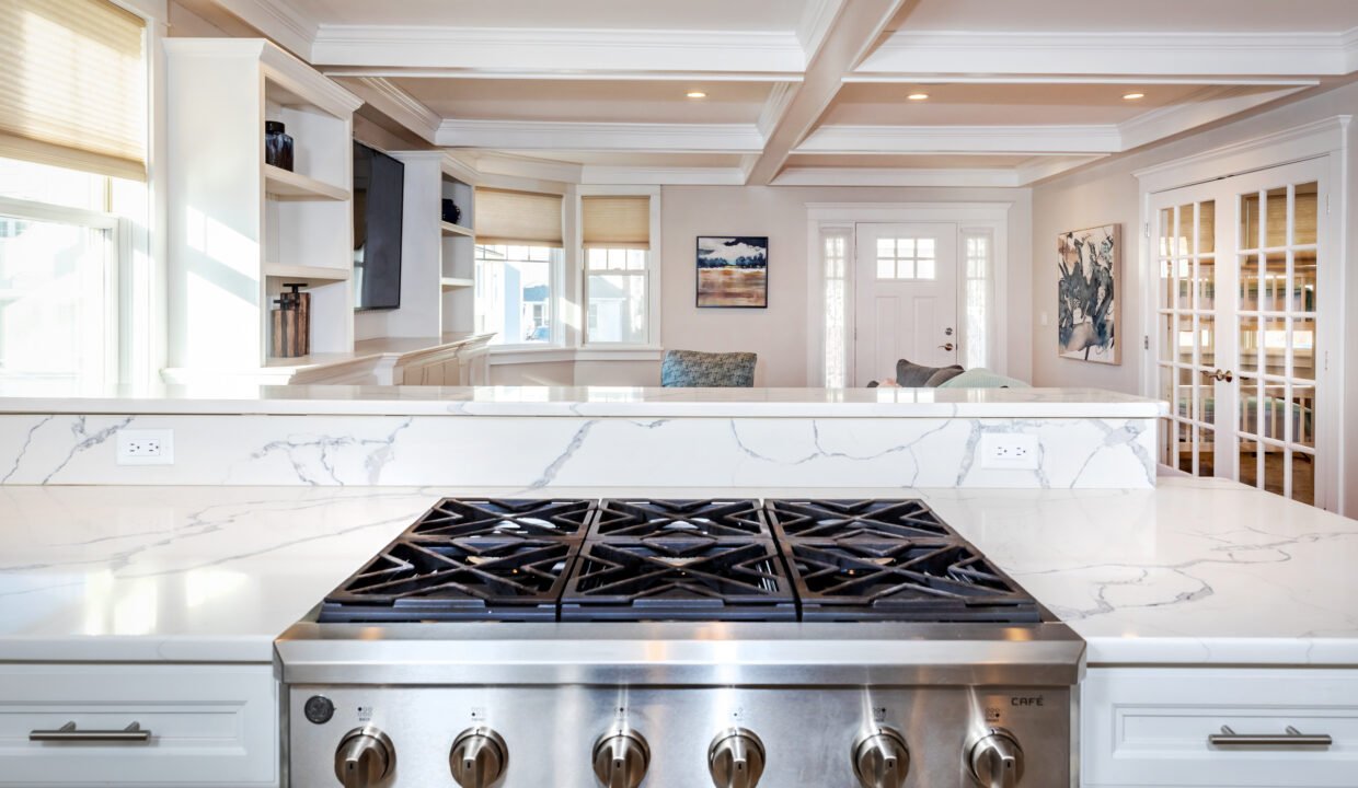 a stove top oven sitting inside of a kitchen.