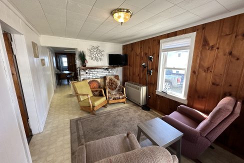 a living room filled with furniture and a flat screen tv.