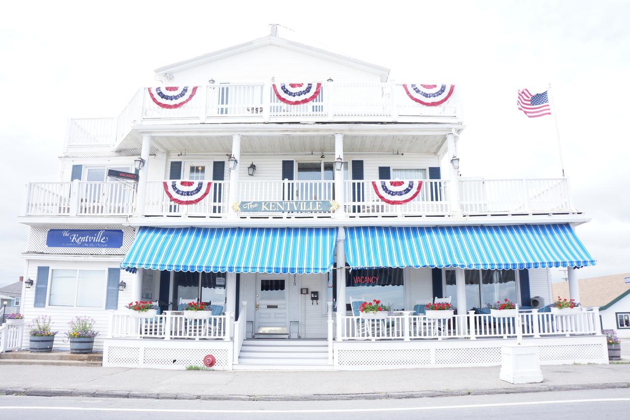 a white building with a blue and white awning.