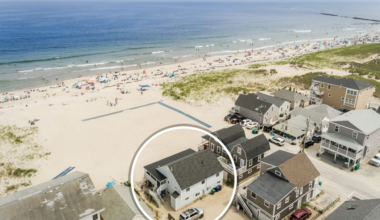 an aerial view of a house on the beach.