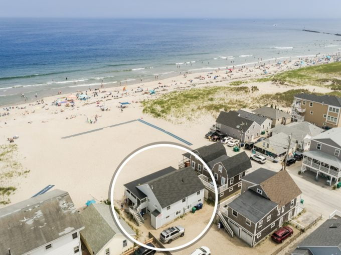 an aerial view of a house on the beach.