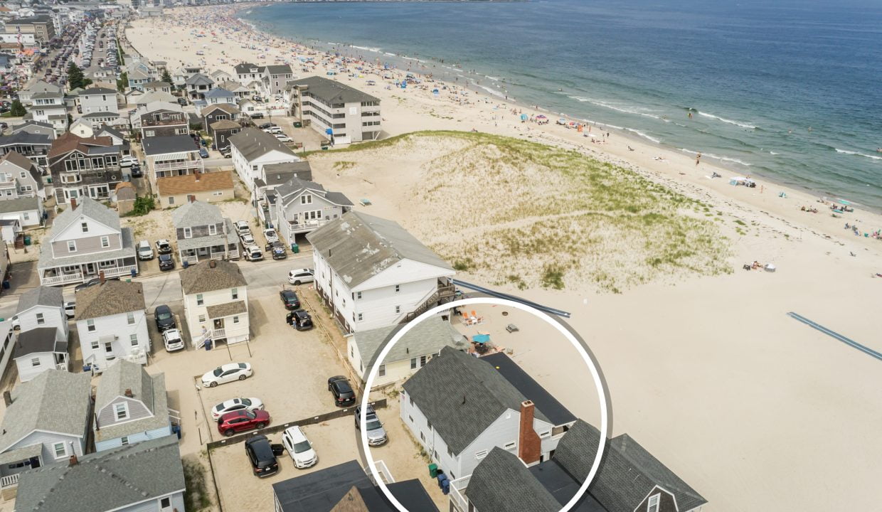 an aerial view of a house on the beach.