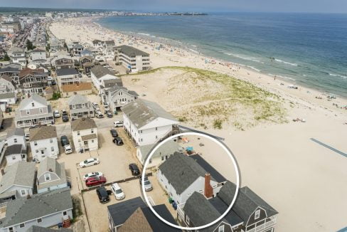 an aerial view of a house on the beach.