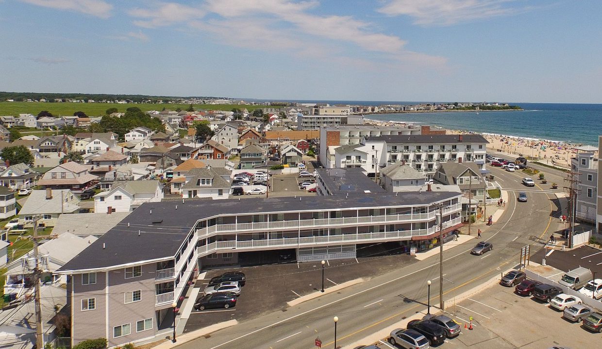 an aerial view of a city by the ocean.