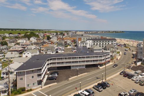 an aerial view of a city by the ocean.