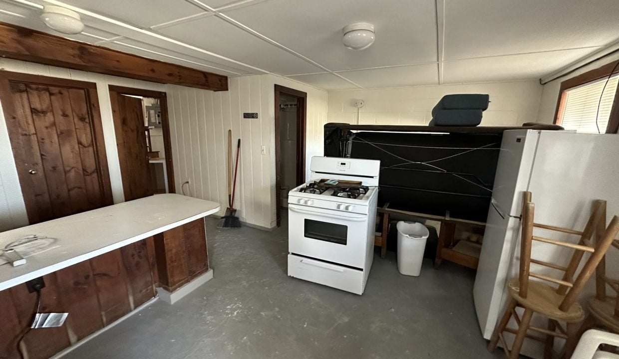 a kitchen with a stove and a refrigerator.