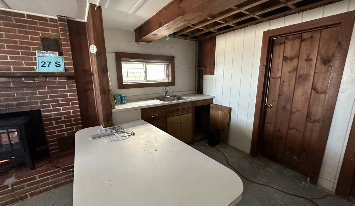 a kitchen with a stove and a sink.