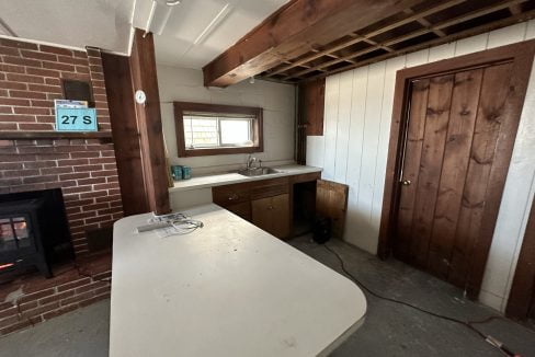 a kitchen with a stove and a sink.