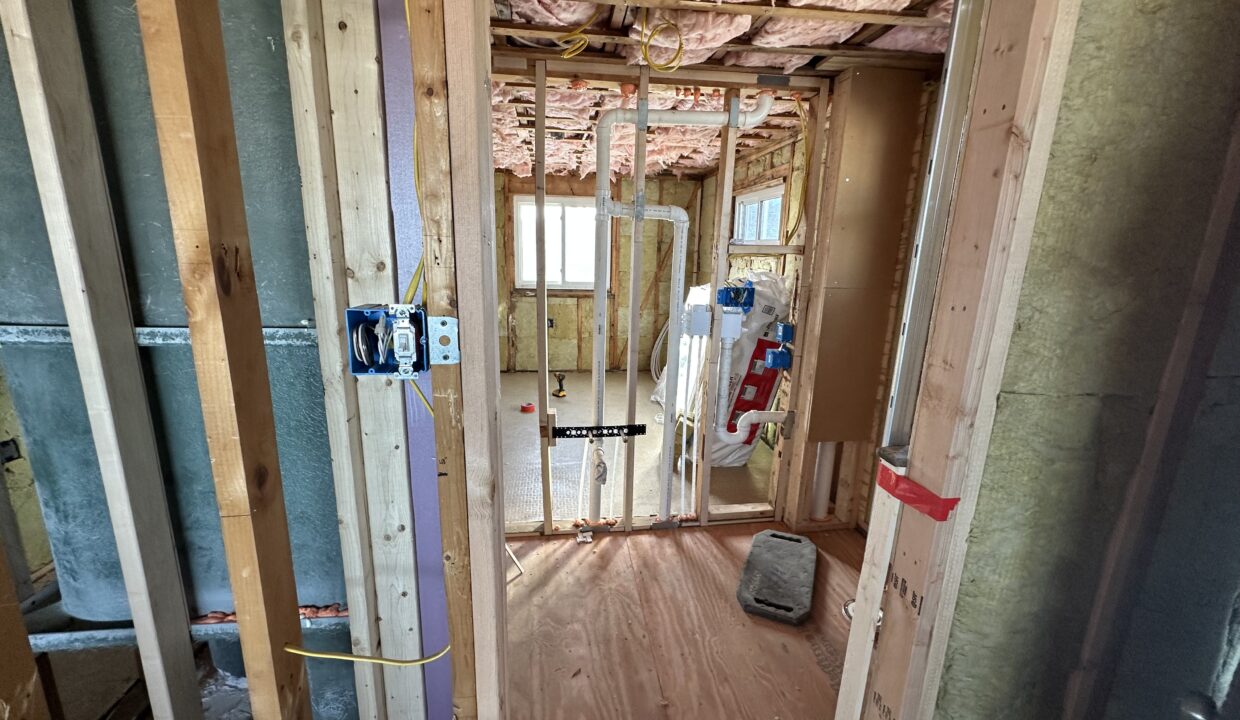 a room that is under construction with a lot of wood.