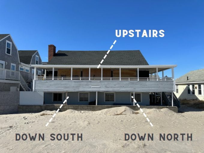 a beach house with the words upstairs above it.