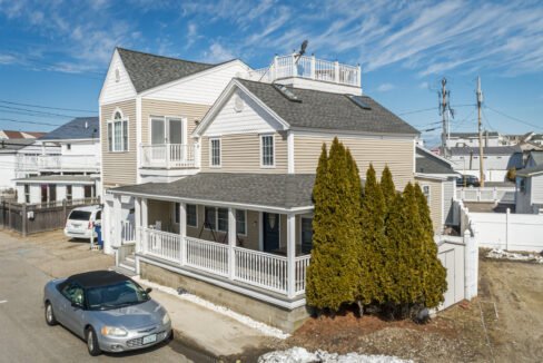 a car is parked in front of a house.