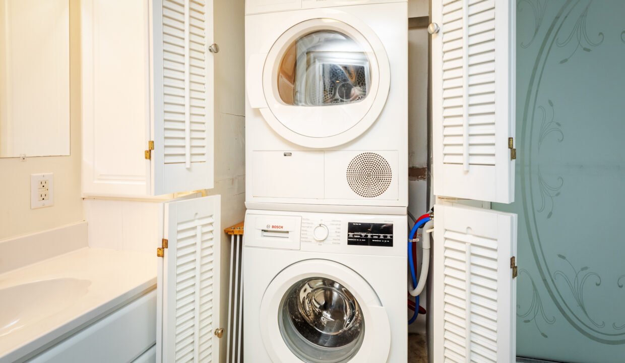 a washer and dryer stacked on top of each other.