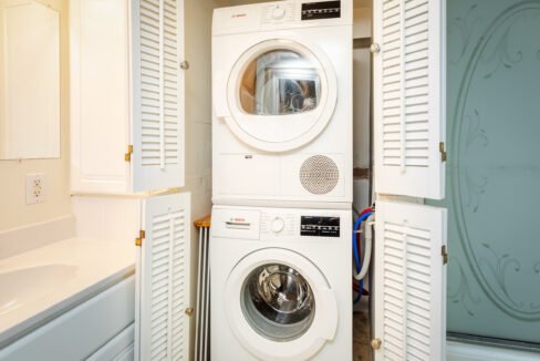 a washer and dryer stacked on top of each other.