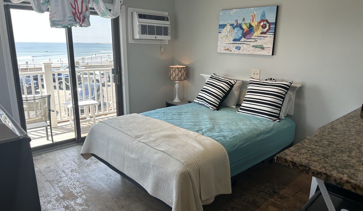 a bed sitting in a bedroom next to a window.
