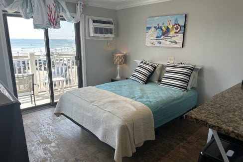 a bed sitting in a bedroom next to a window.