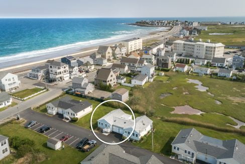 an aerial view of a beach front neighborhood.