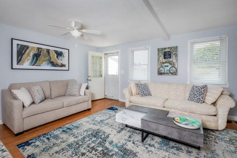 a living room with two couches and a coffee table.