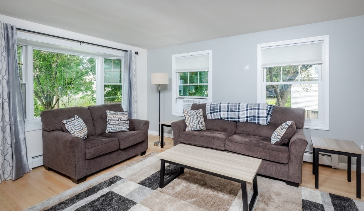 A living room with couches and a coffee table.