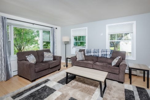 A living room with couches and a coffee table.