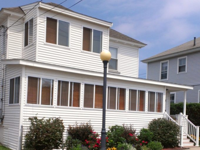 A white house on a street.