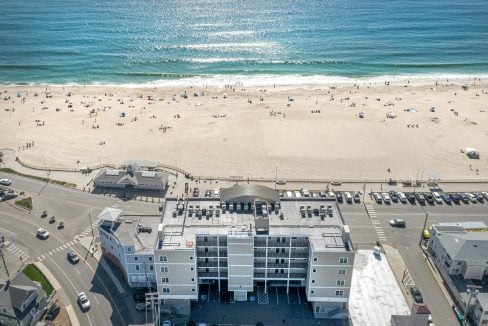 An aerial view of a beach and a building.