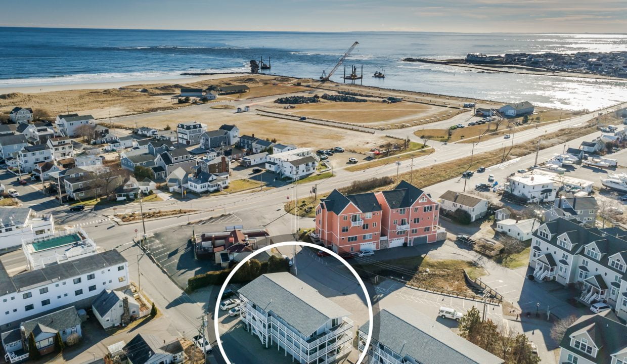 An aerial view of a house near the ocean.