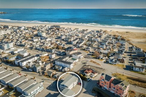 An aerial view of a house near the ocean.