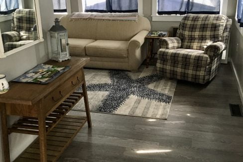 A living room with a couch and a coffee table.