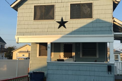 A blue house with a star on it.